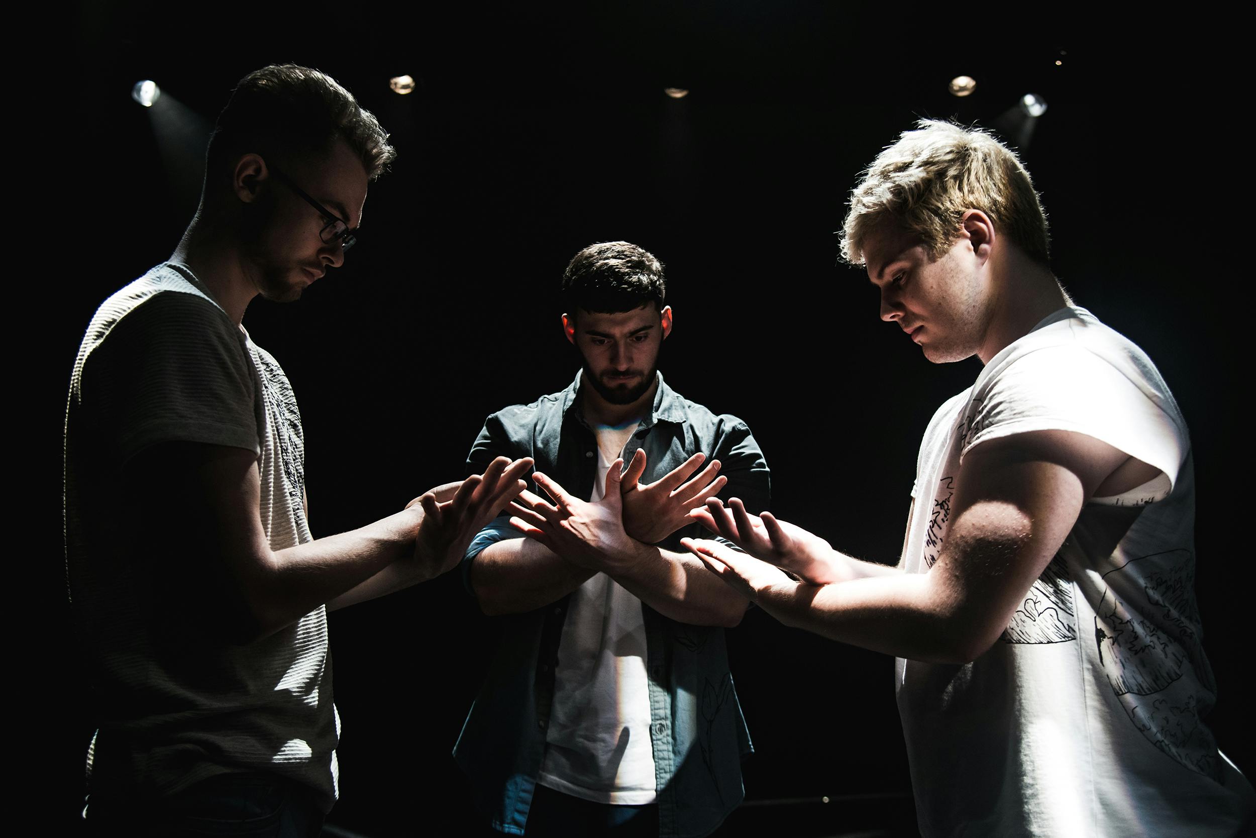 Three male dancers performing in That Happy Place show as part of AUB's BA (Hons) Dance course