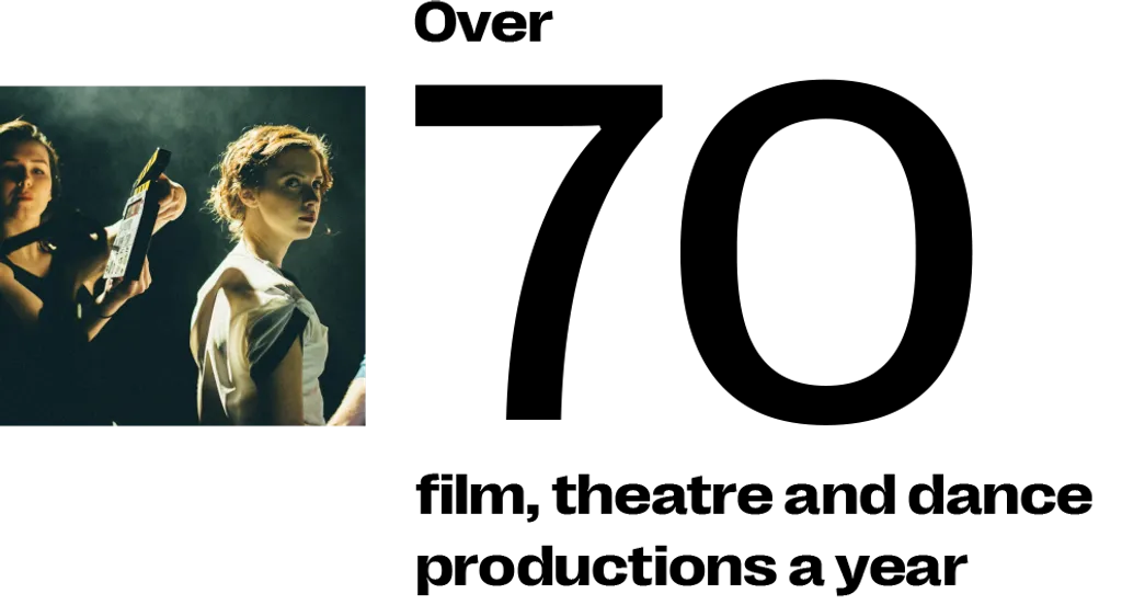 Two people in dark clothing against green-tinted background, positioned on left side of frame with large black empty space on right.