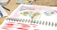 Watercolour paintings in a sketchbook