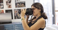 Student using a DSLR camera