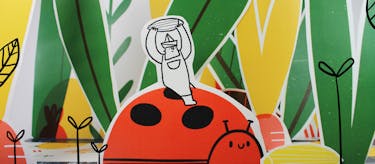 Illustration of a man holding a seed on top of a ladybird