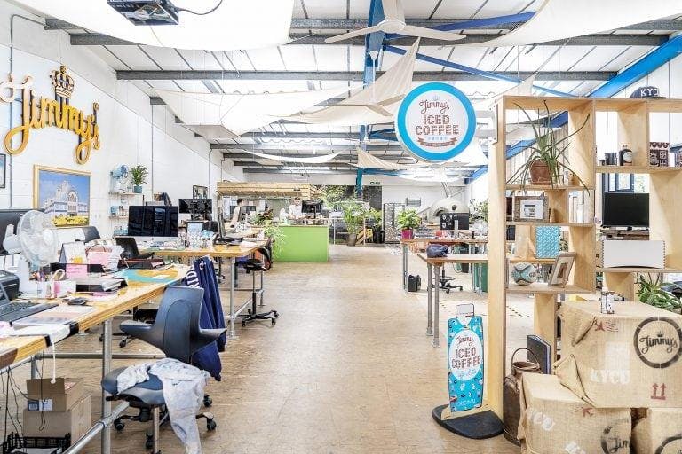 Interior of Jimmy’s Iced Coffee HQ, a large-scale office with the logo.