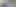 Three people pose for a photo at an animation studio