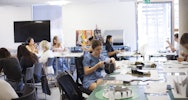 Students working around a table