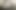 People sitting around a table looking up at a board