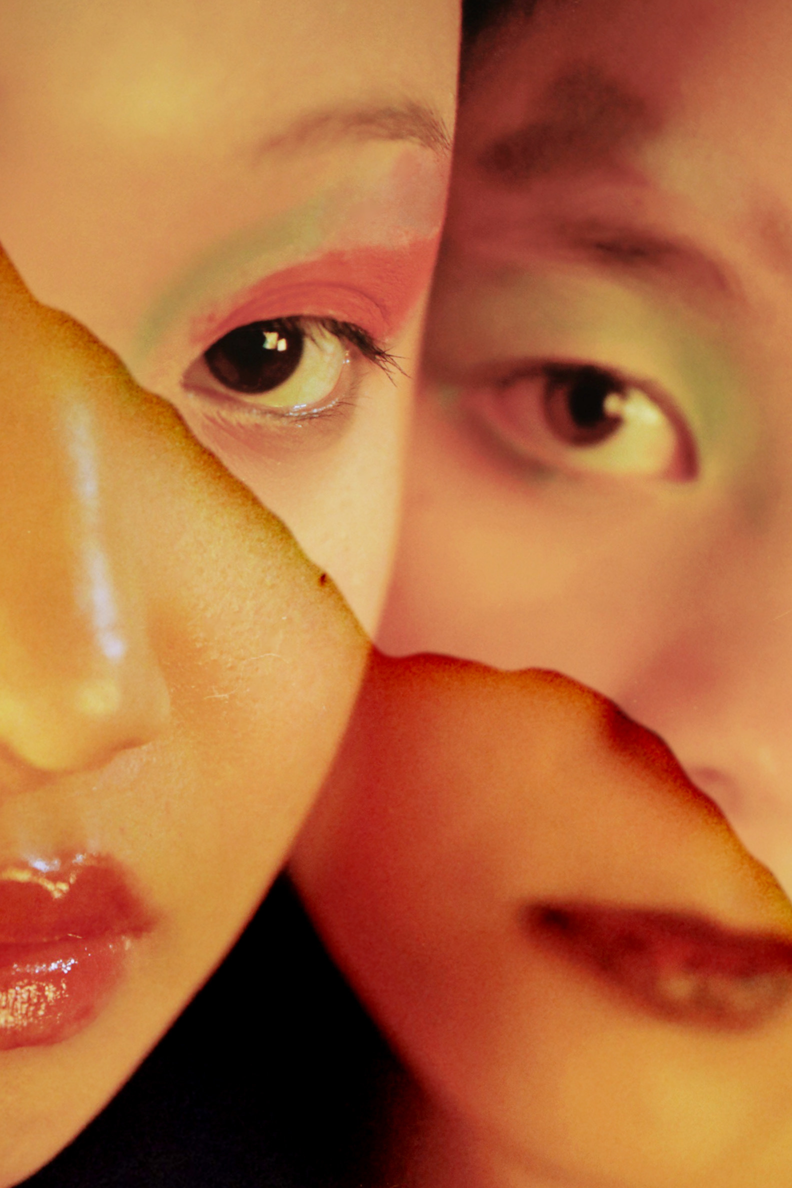 photograph of 2 female faces with colourful eyeshadow and red lipstick.