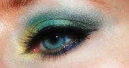 Close up photograph of make-up around an eye