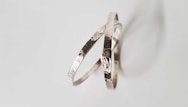 Close up of a pair of silver rings