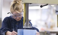 Student using tools in a Workshops