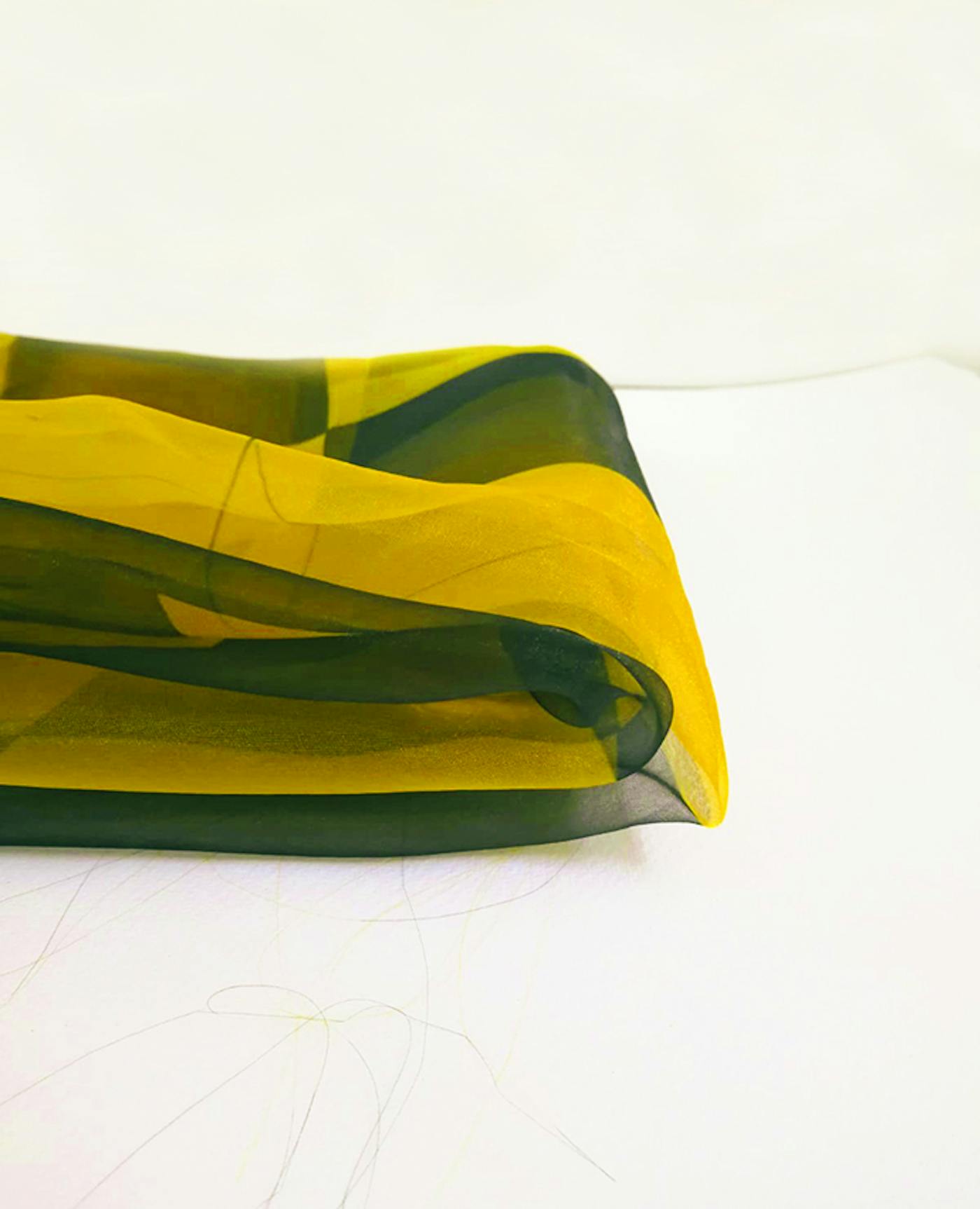 A piece of mustard coloured material