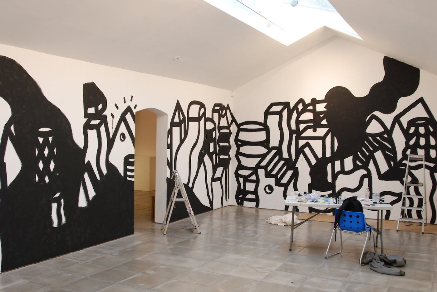 Keith Haring inspired artwork painted on a wall
