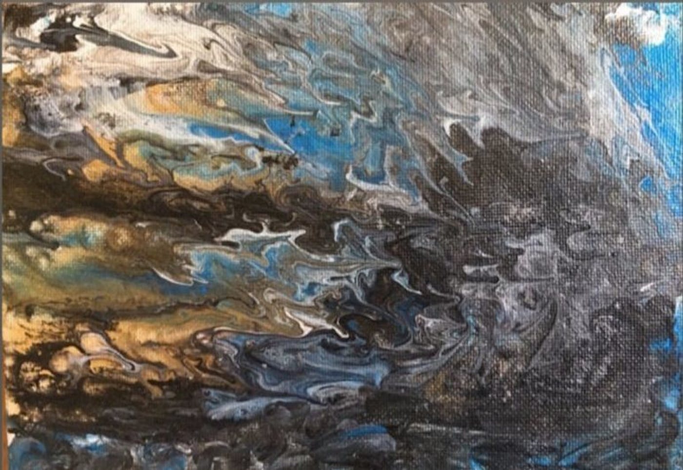 Artwork of blue, orange, white, black paint swirled onto a canvas