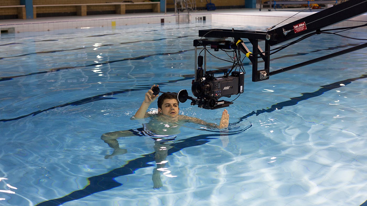 Film shoot over a swimming pool