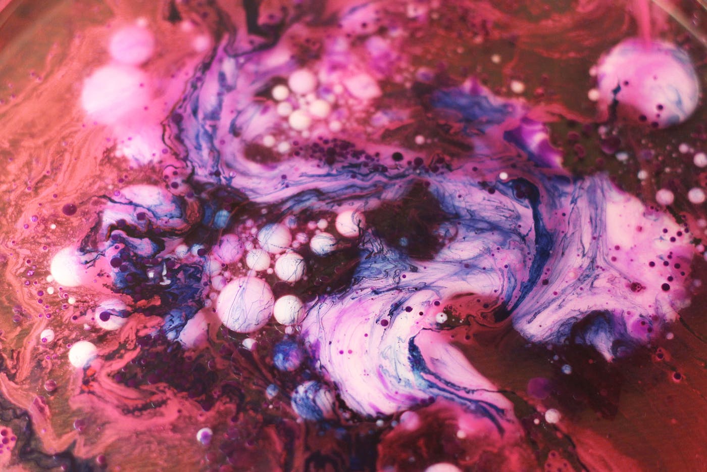 Red, purple and white ink mixed together.