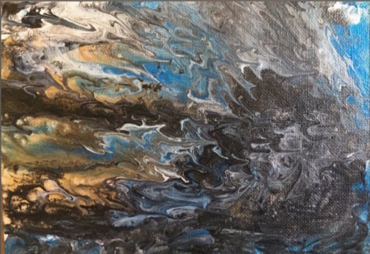 Artwork of blue, orange, white, black paint swirled onto a canvas