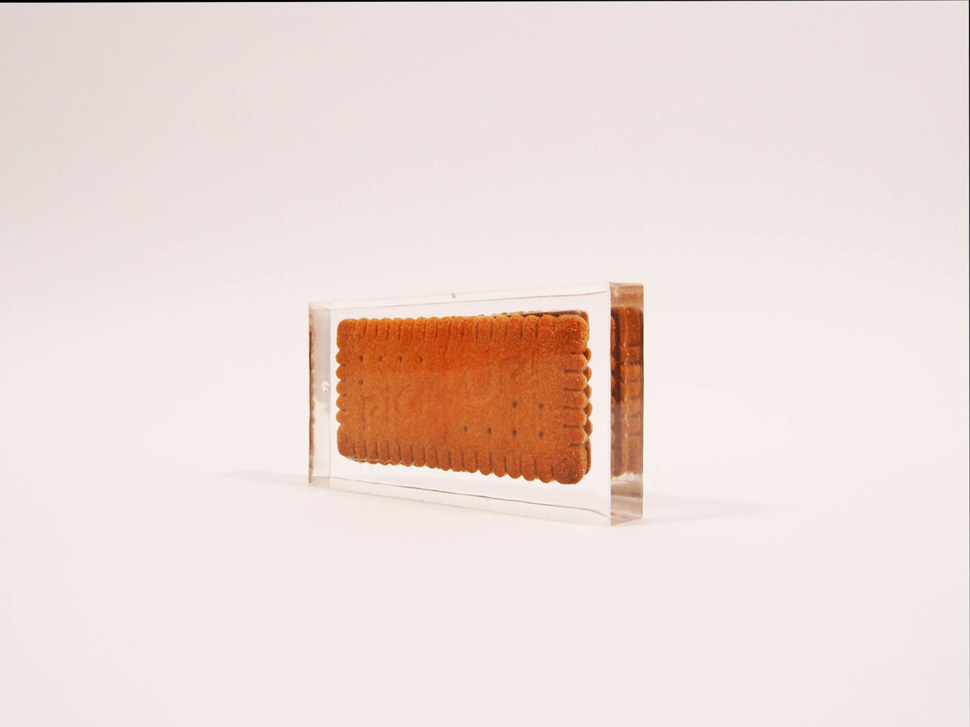 A 'Nice' biscuit encased in a clear display box